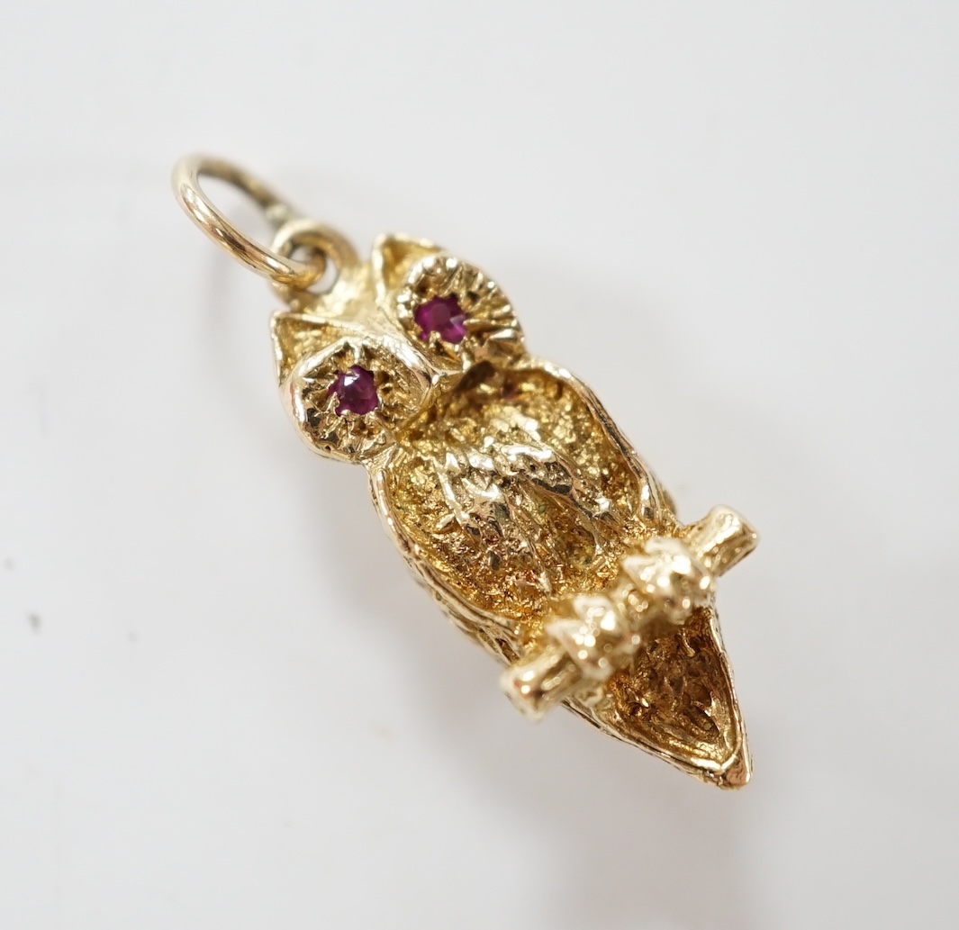 A 1960's 9ct gold and two stone gem set owl on a perch pendant, 26mm, gross weight 5 grams. Condition - good